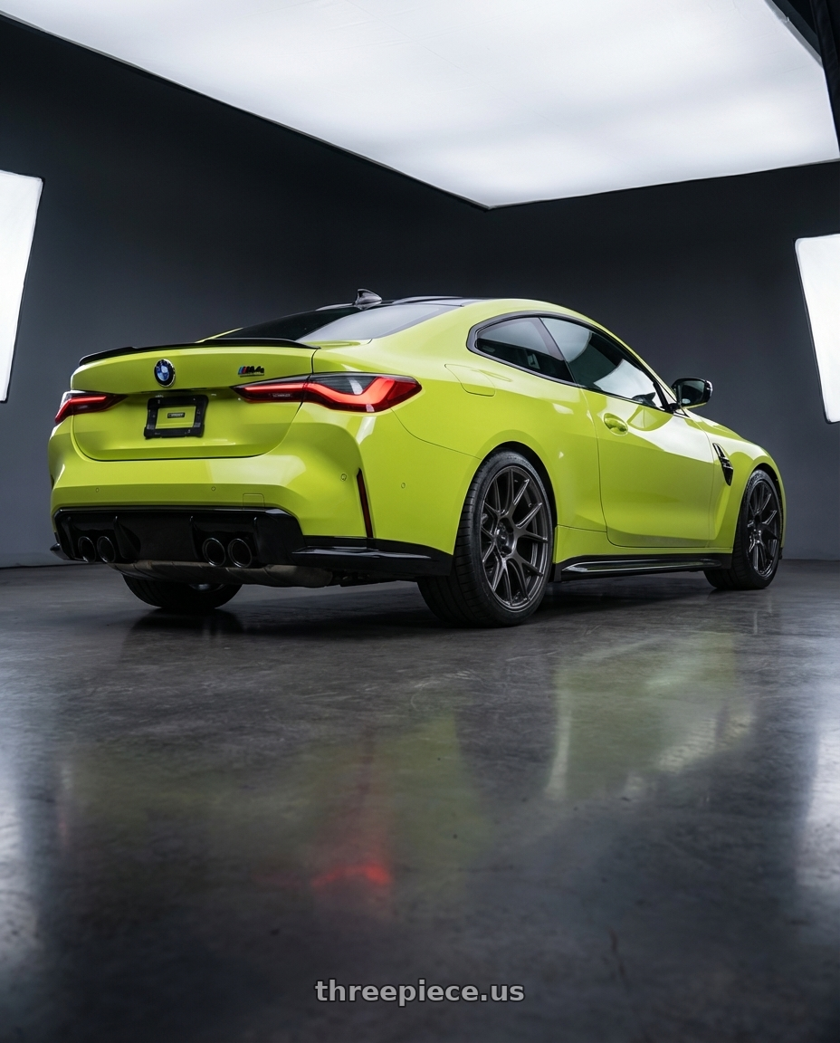 2024 BMW M4 G82 with Konig Ampliform 5x112 19x8.5+32 Dark Metallic Graphite wheels rear three quarter view square tires