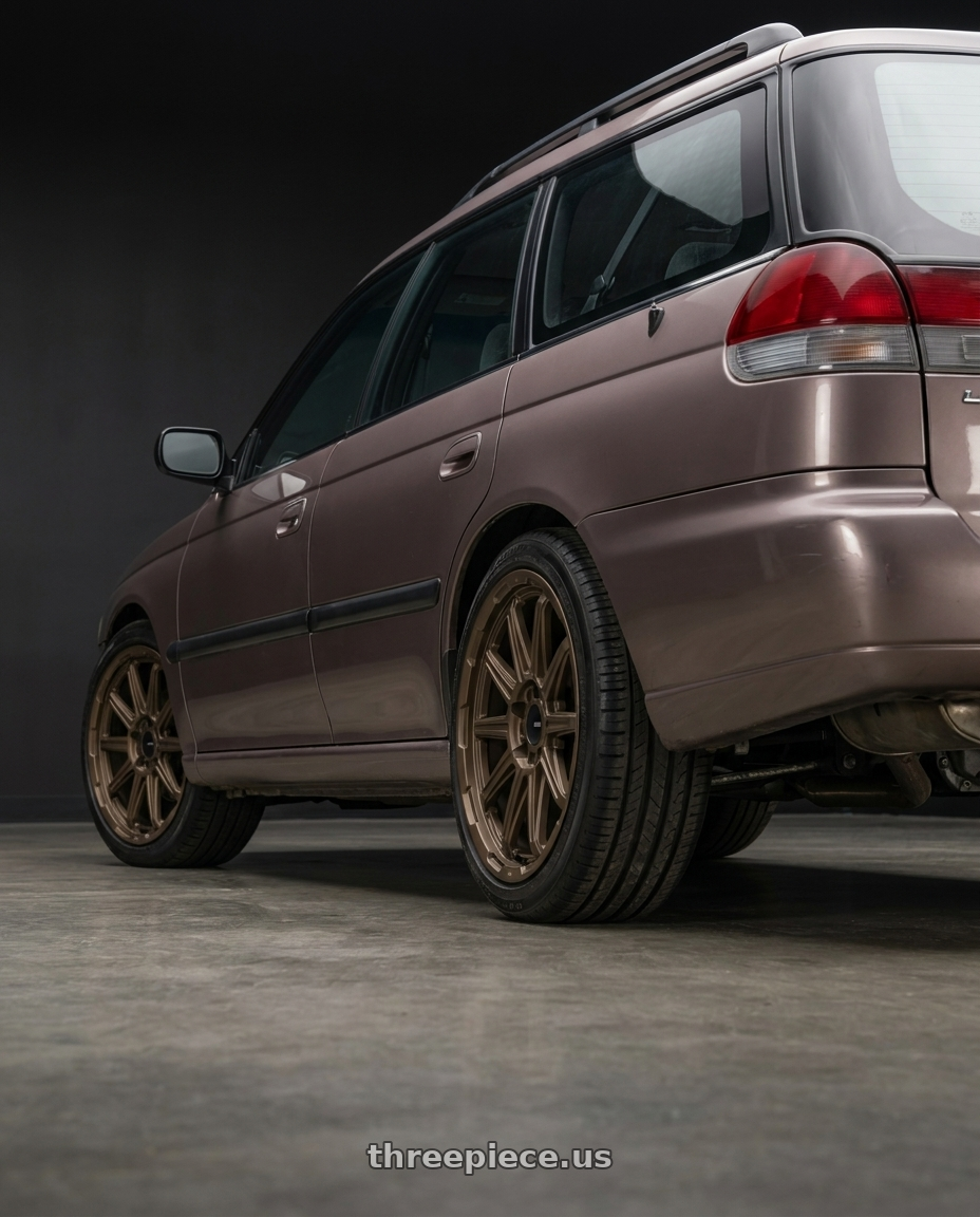 1995 subaru legacy wagon brown with Enkei Adventurer 5x100 17x7.5+35 Matte Bronze wheels rear three quarter view slight stretch tires