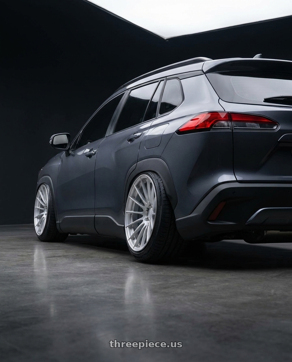 2023 Toyota corolla cross with Enkei RS05-RR 5x114.3 18x11+16 Sparkle Silver wheels rear three quarter view slight stretch tires