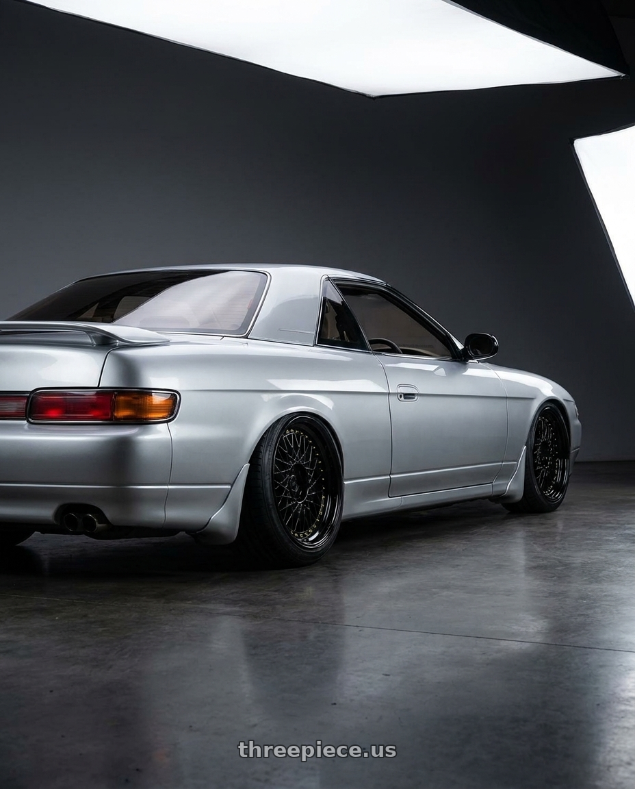 1990 eunos cosmo with Aodhan AH05 5x114.3 18x9.5+35 Gloss Black W /Gold Rivets wheels rear three quarter view slight stretch tires