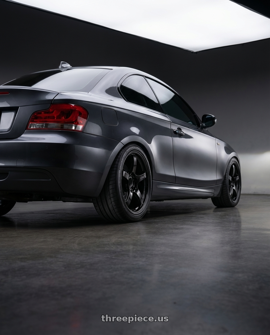 2012 BMW 1 Series E82 with Gram Lights 57CR 5x120 18x9.5+38 Glossy Black wheels rear three quarter view square tires