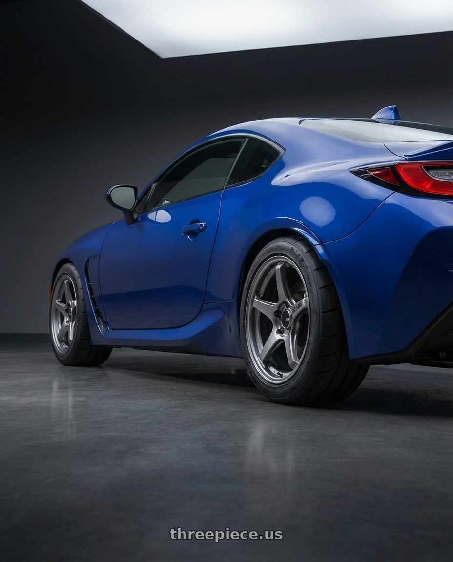 2023 Toyota GR86 with Enkei TS-5 5x100 18x8.5+45 Storm Grey wheels rear three quarter view meaty tires