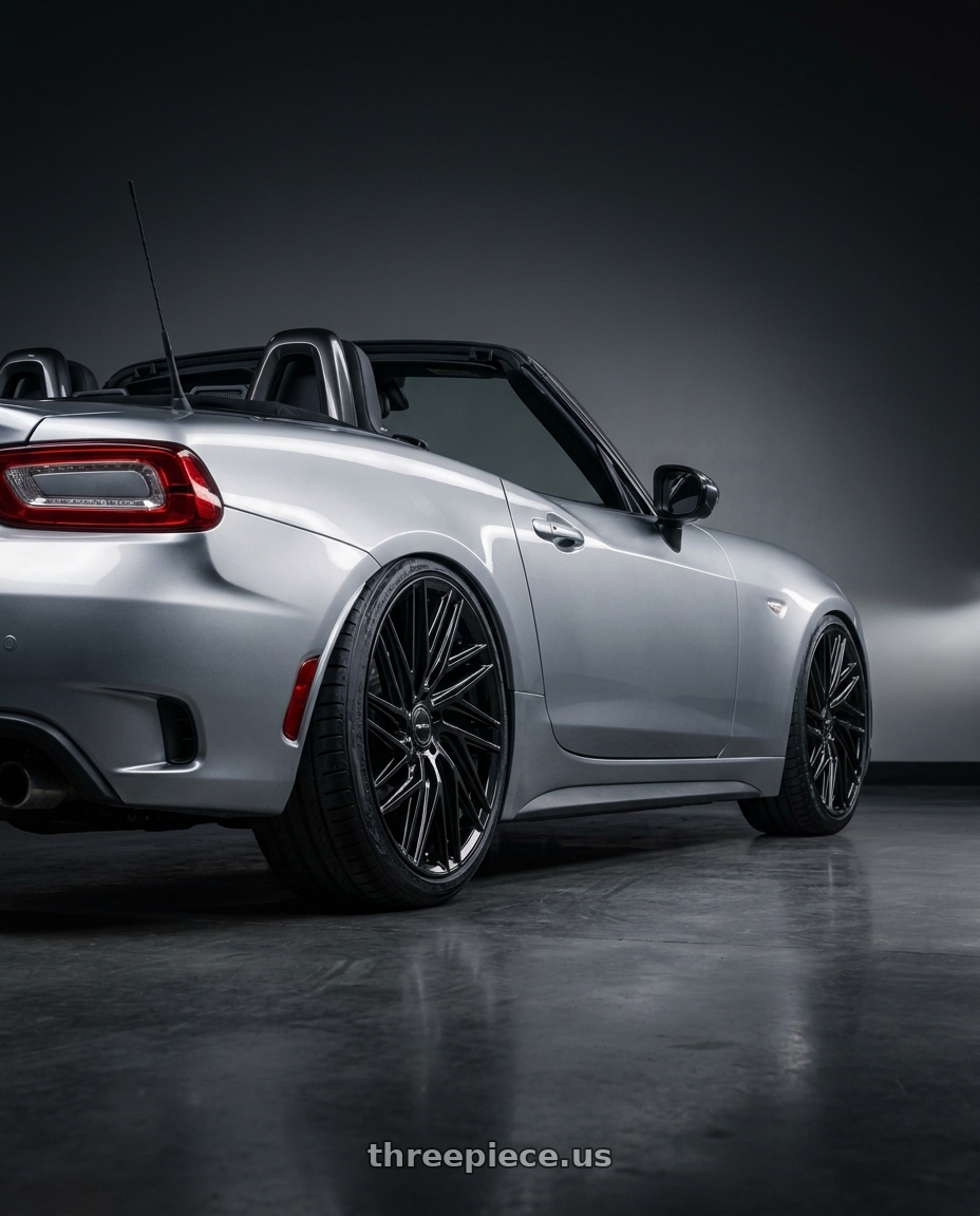 2020 Fiat 124 Spider GT with Motiv 429B Align 5x114.3/5X120 18x8 +40 Gloss Black wheels rear three quarter view slight stretch tires