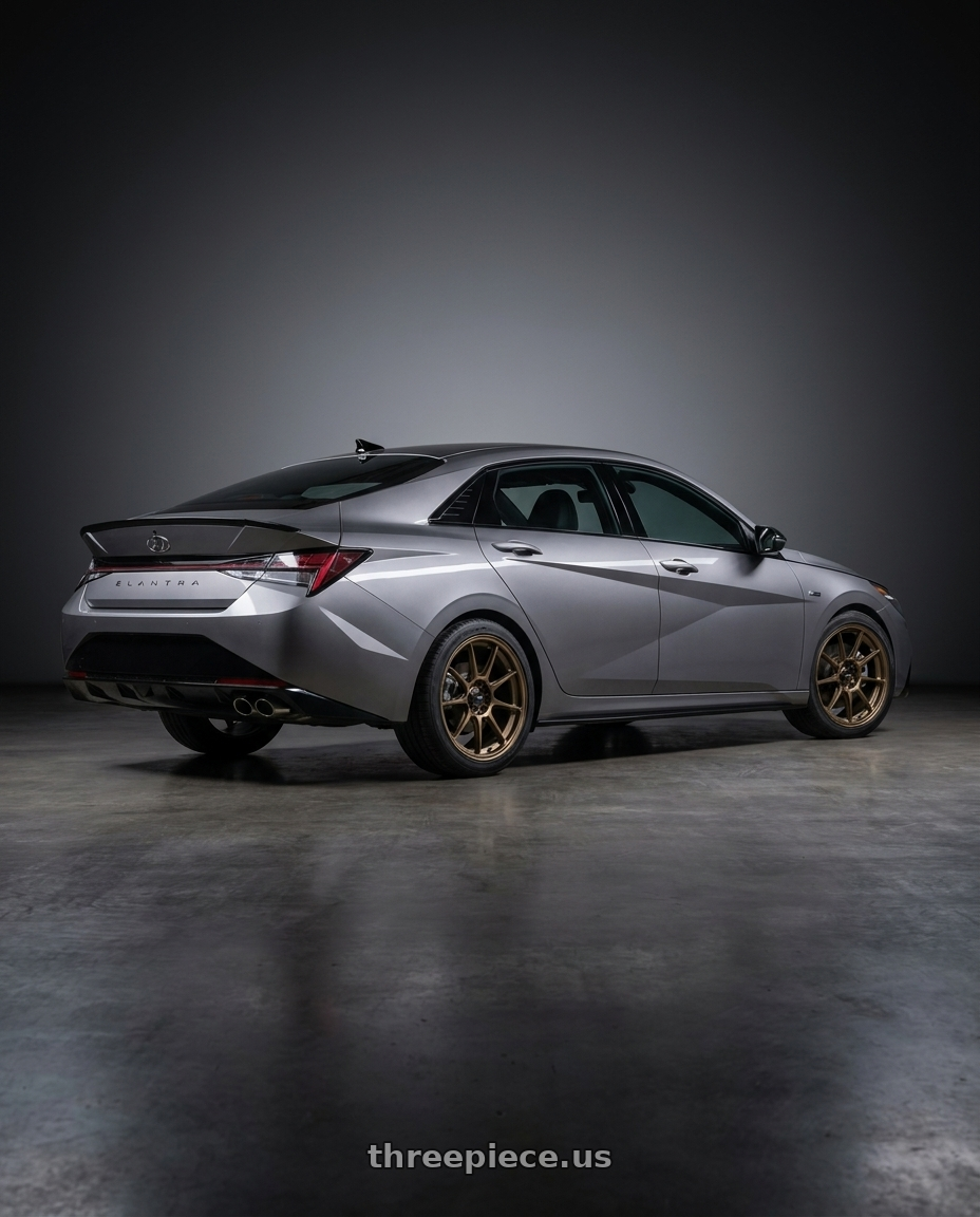 2023 Hyundai Elantra n line with Konig Dekagram 5x114.3 17x8+40 Gloss Bronze wheels rear three quarter view square tires