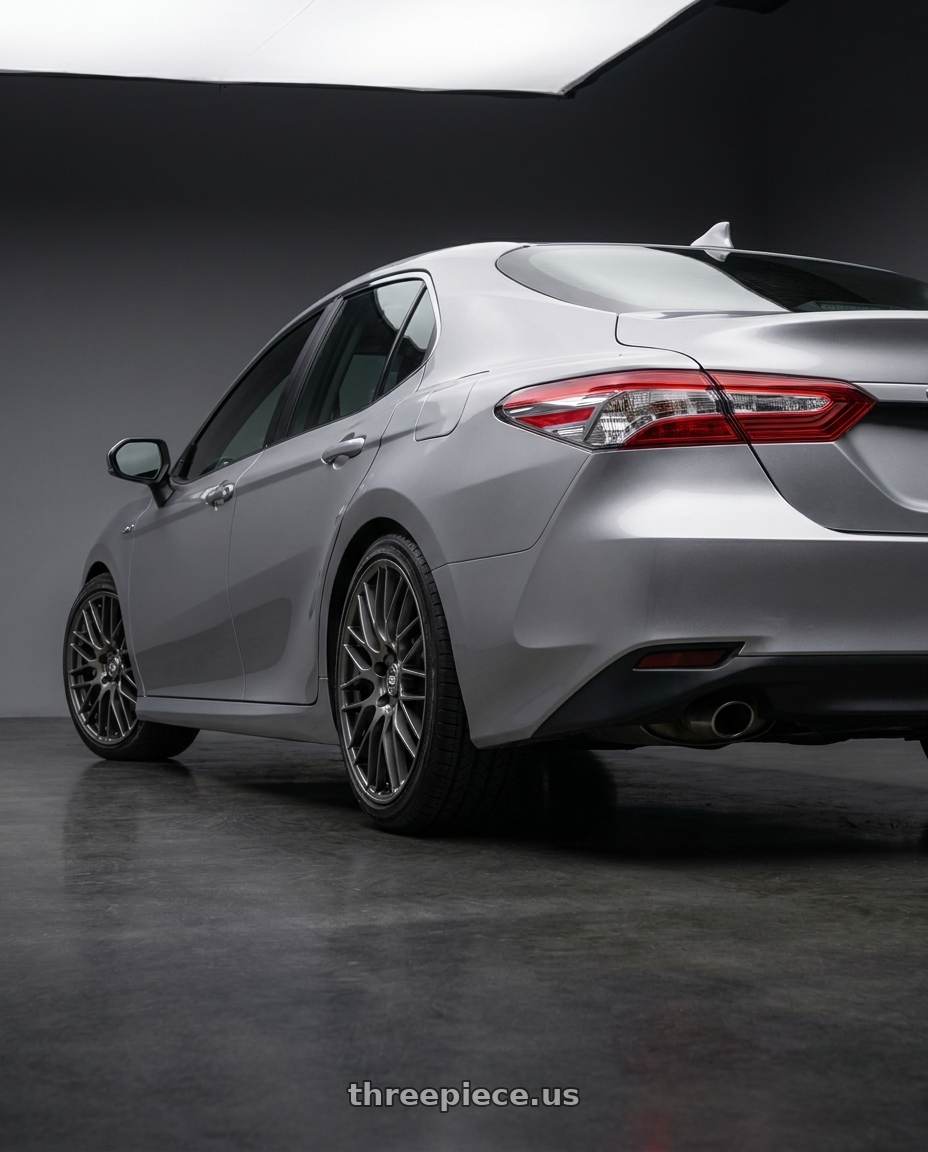 2021 Toyota Camry Hybrid LE with Enkei EKM3 5x114.3 18x7.5+45 Gunmetal wheels rear three quarter view square tires