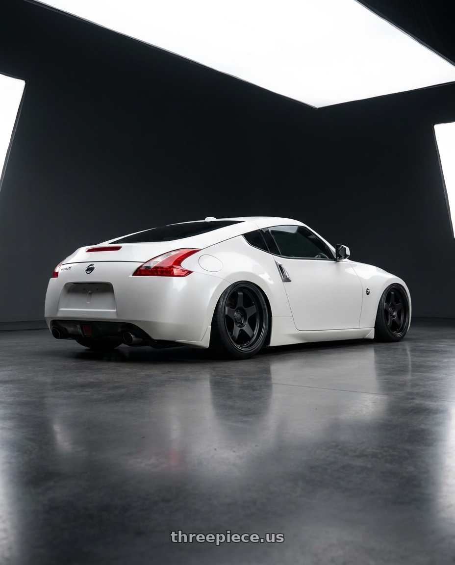 2019 Nissan 370Z with fifteen52 CHICANE 5x114.3 / 5x120 19x8.5 +35 ASPHALT BLACK (SATIN BLACK) wheels rear three quarter view slight stretch tires