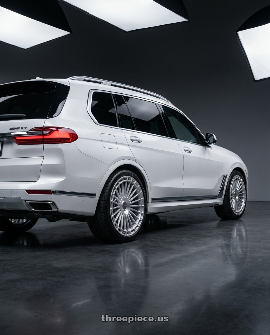 2025 BMW X7 with MV Forged MVF40 5x112 22x10.5 +45 Diamond Silver wheels rear three quarter view square tires