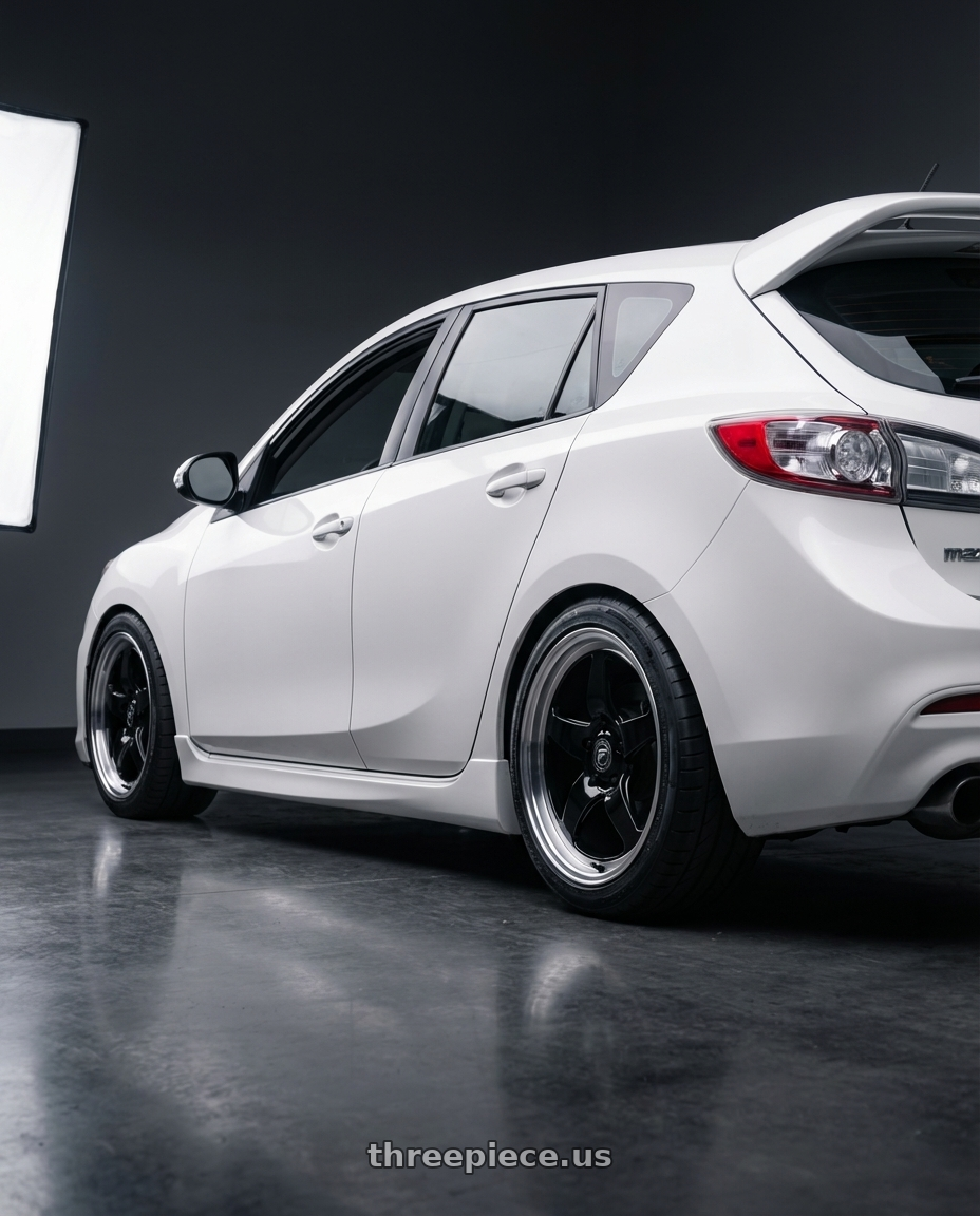 2012 Mazda Mazdaspeed3 with Forgestar D5 Drag 5x114.3 18x10 +42 Gloss Black Machined wheels rear three quarter view square tires