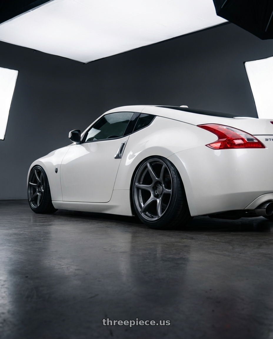 2019 Nissan 370Z with Kansei K11G Tandem 5x114.3 19x9.5 12 Gunmetal wheels rear three quarter view slight stretch tires