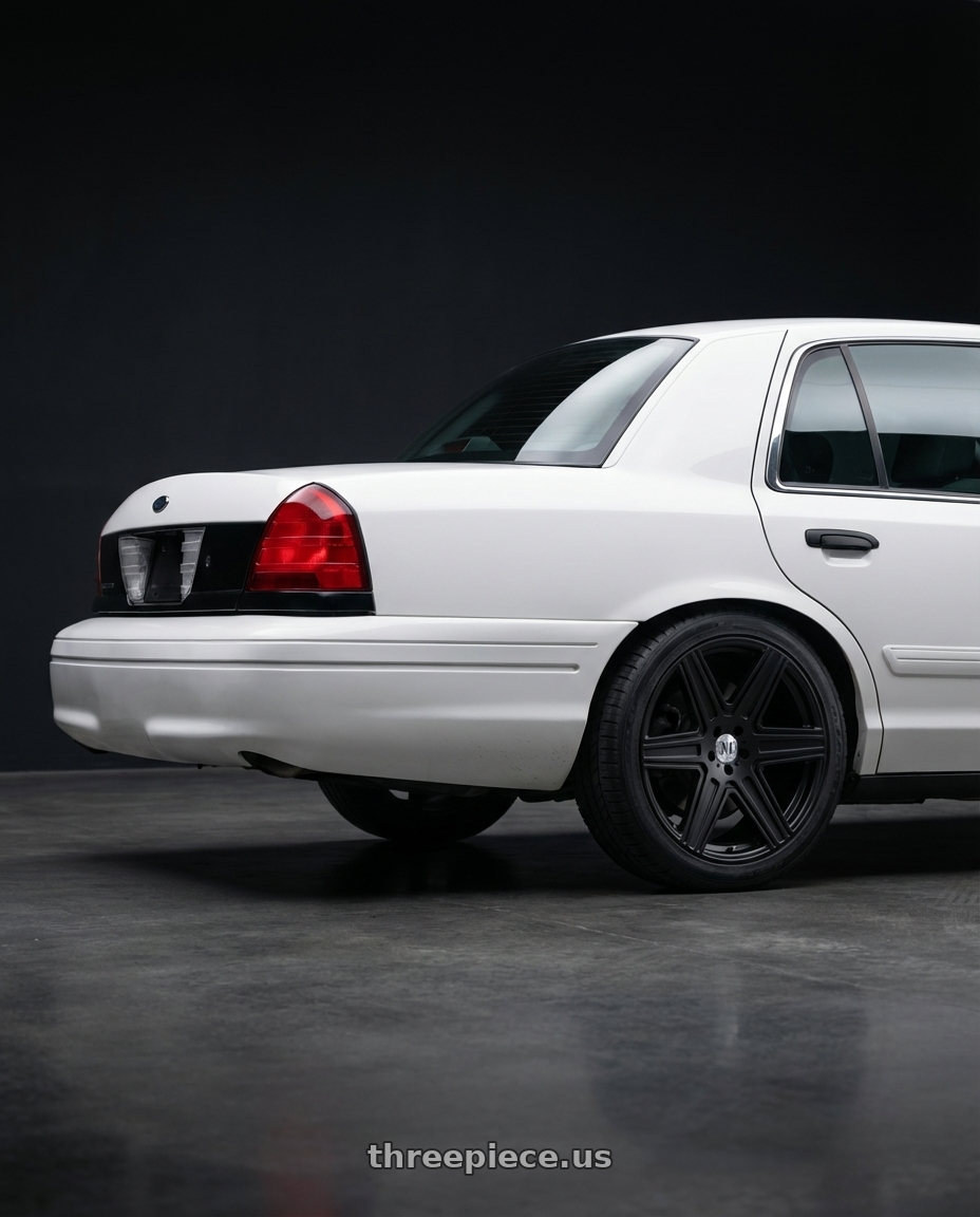 2011 Ford Crown Victoria Police Interceptor with Mandrus ATLAS 6X130 16X7 +52 MATTE BLACK wheels rear three quarter view square tires