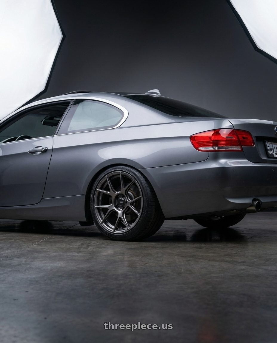 2008 BMW 335i E92 with Konig Ampliform 5x120 18x8.5+32 Dark Metallic Graphite wheels rear three quarter view slight stretch tires