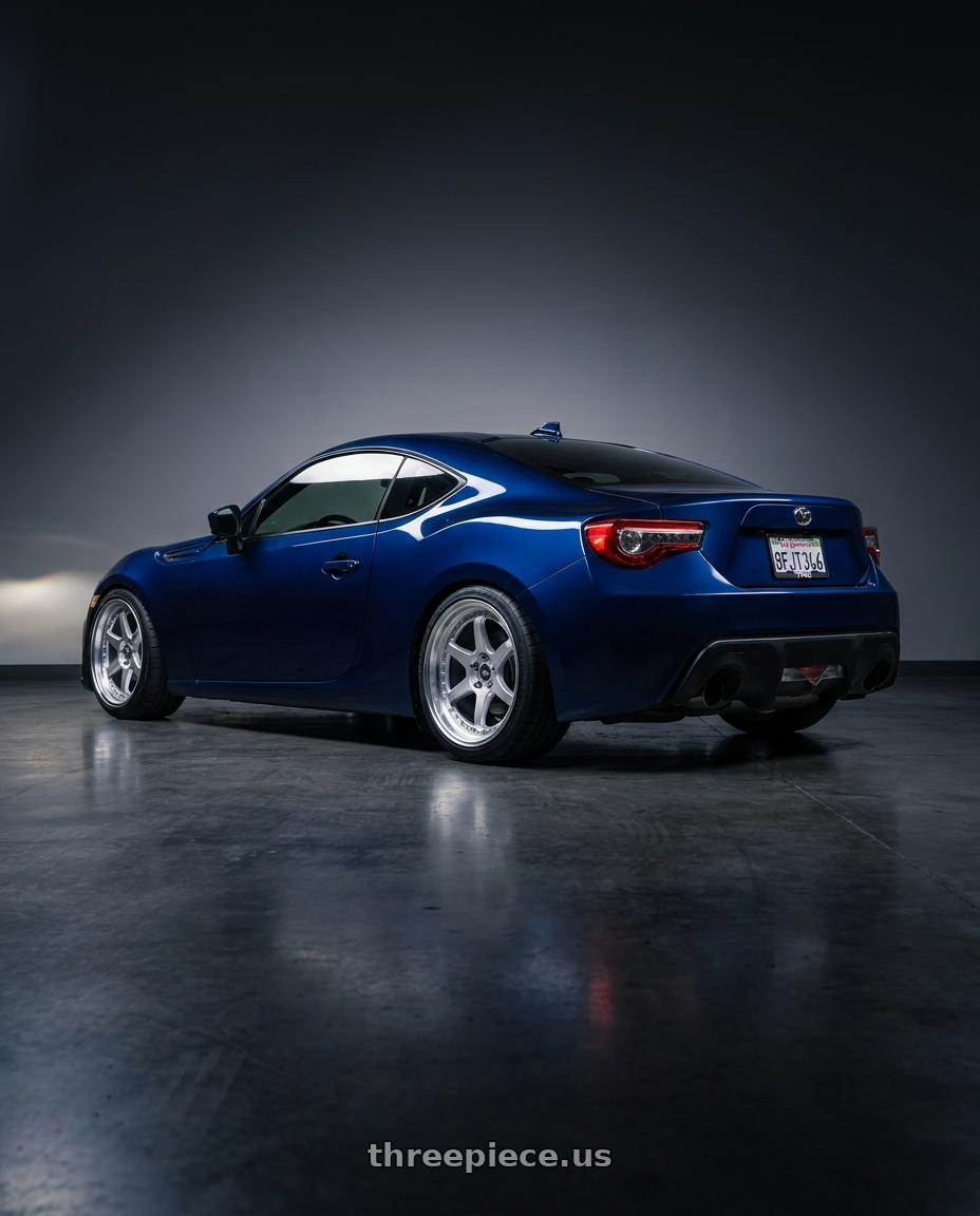 2017 Toyota 86 dark blue with ESR Wheels CS12 5x100 18x8.5 +35 Hyper Silver wheels rear three quarter view square tires