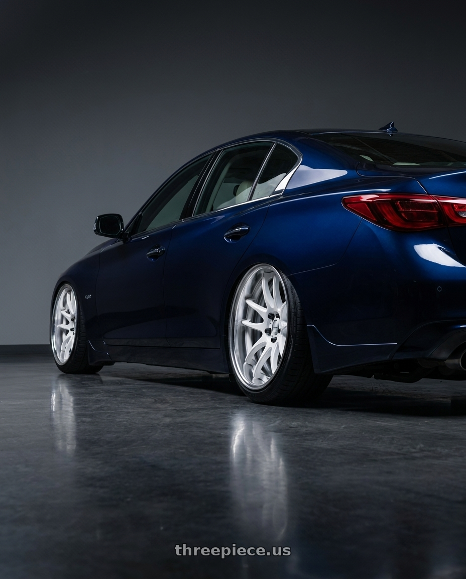  2023 Infiniti Q50 Luxe with Work Cr 2P 4x100 17x10.0 +18 Gloss White wheels rear three quarter view slight stretch tires