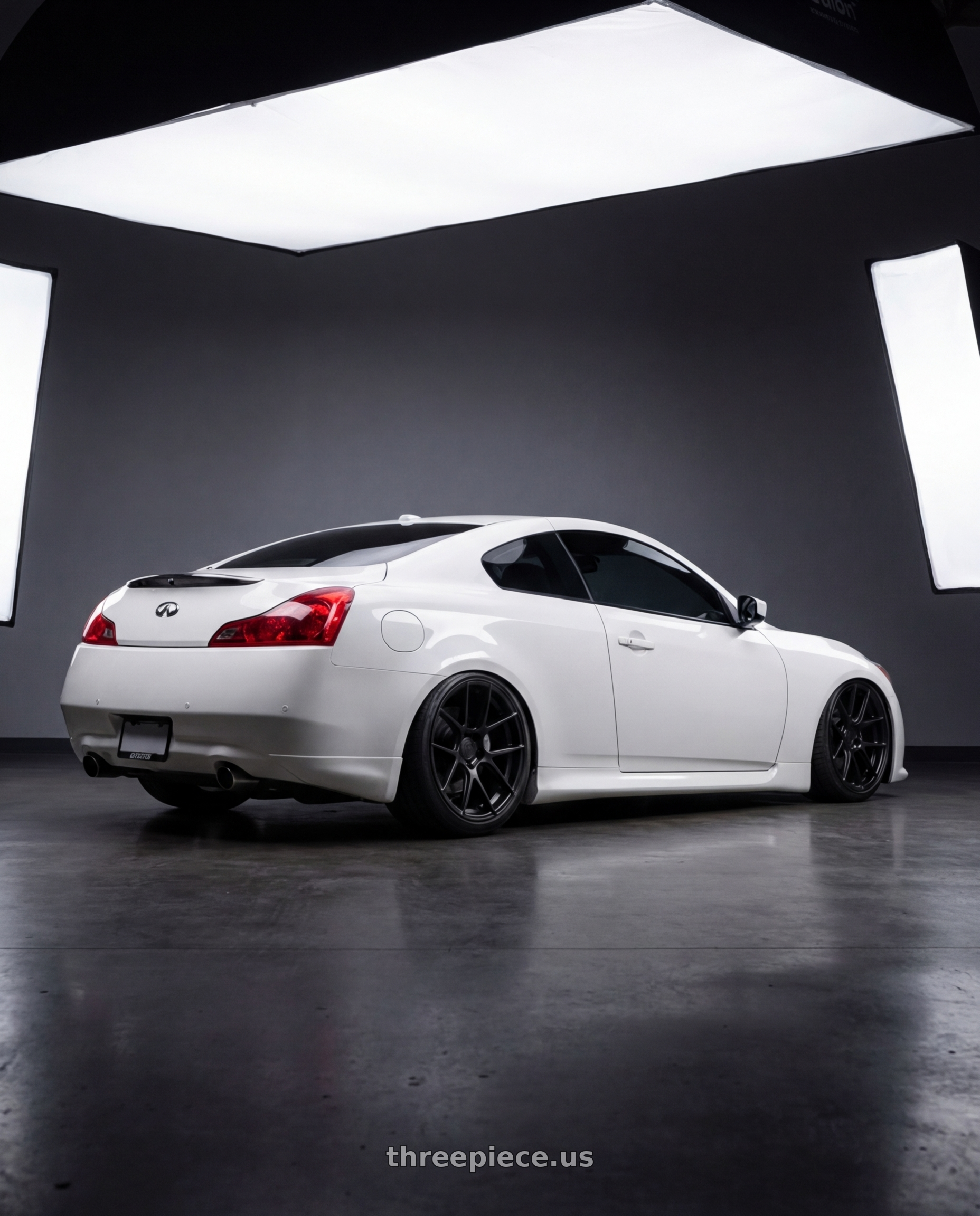 2014 Infiniti G37 Coupe with Avant Garde Wheels M510 5X114.3 19x9.5 +40 Matte Black wheels rear three quarter view slight stretch tires