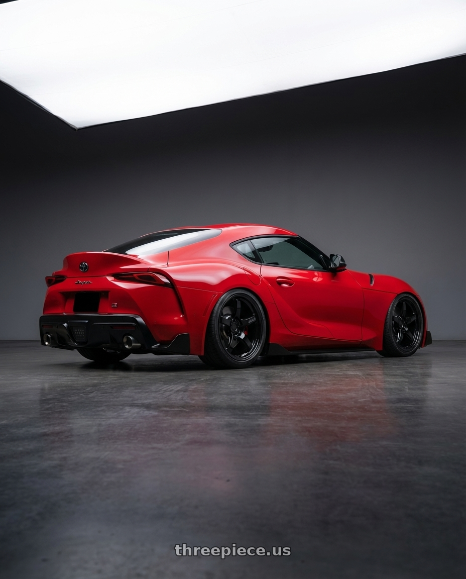 2023 Toyota GR Supra with Gram Lights 57CR 5x112 19x10.5+22 Glossy Black wheels rear three quarter view slight stretch tires