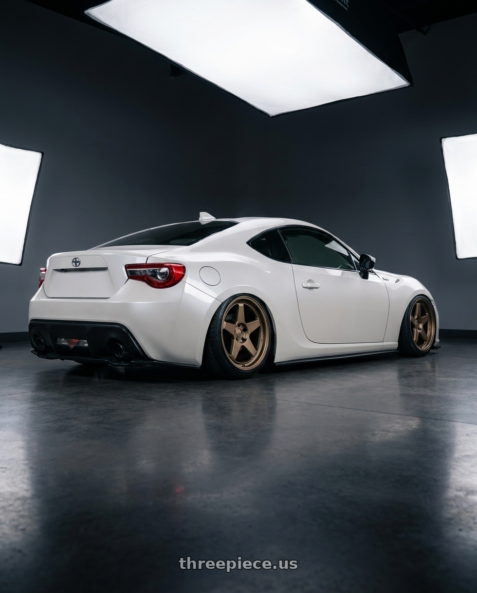 2016 Scion FR-S with Kansei K12B KNP 5X100 17x9 35 Bronze wheels rear three quarter view slight stretch tires