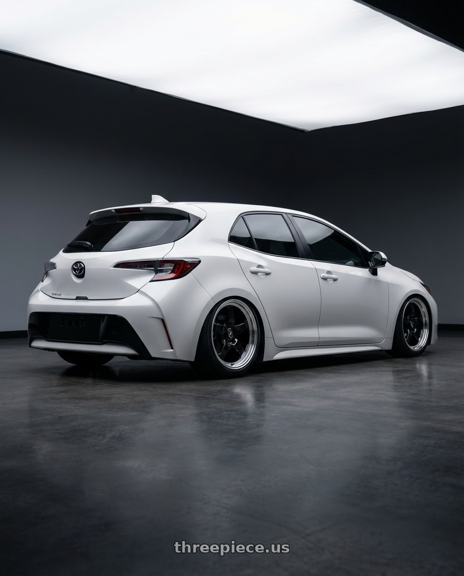 2023 Toyota Corolla Hatchback with Forgestar D5 Drag 5x114.3 18x10 +22 Gloss Black Machined wheels rear three quarter view slight stretch tires