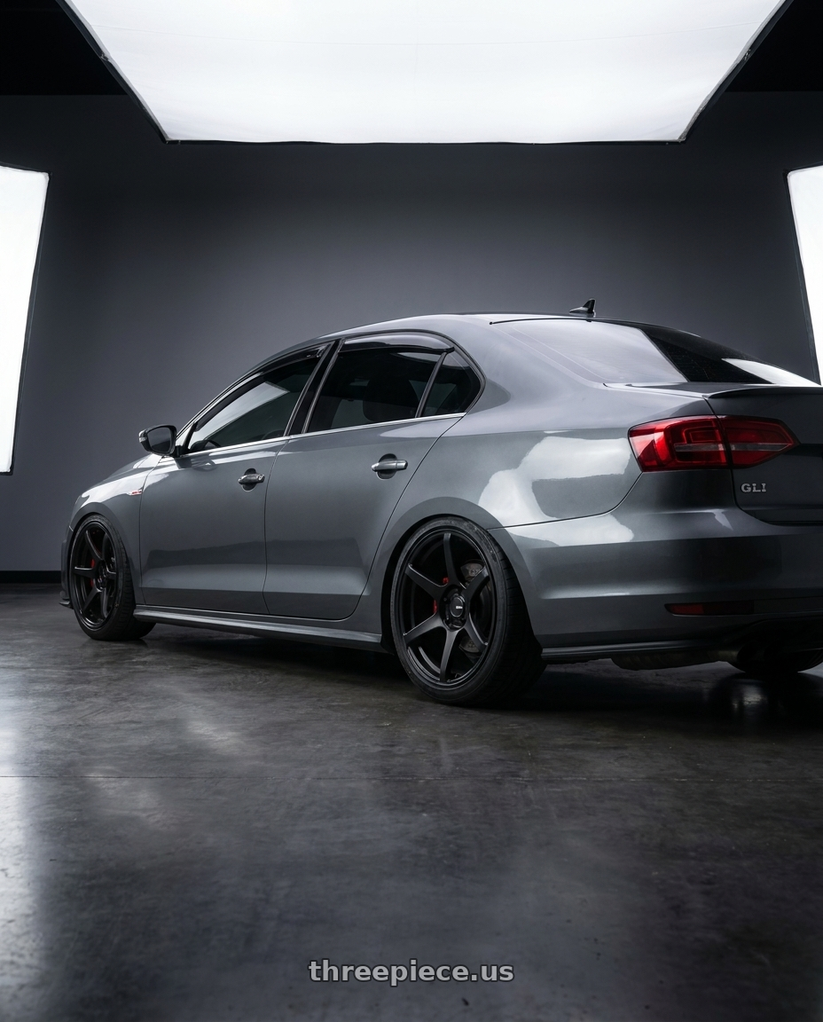 2016 VW GLI with Enkei Kojin 5x114.3 18x8.5+35 Matte Black wheels rear three quarter view slight stretch tires