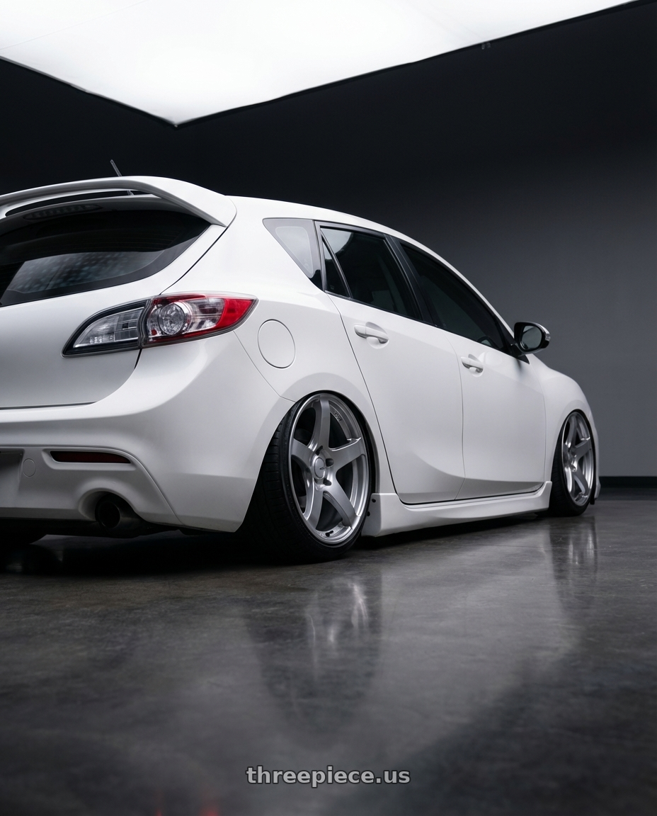 2012 Mazda Mazdaspeed3 with Ssr Gtv01 5x114.3 18x10.5+15  GLARE SILVER wheels rear three quarter view slight stretch tires