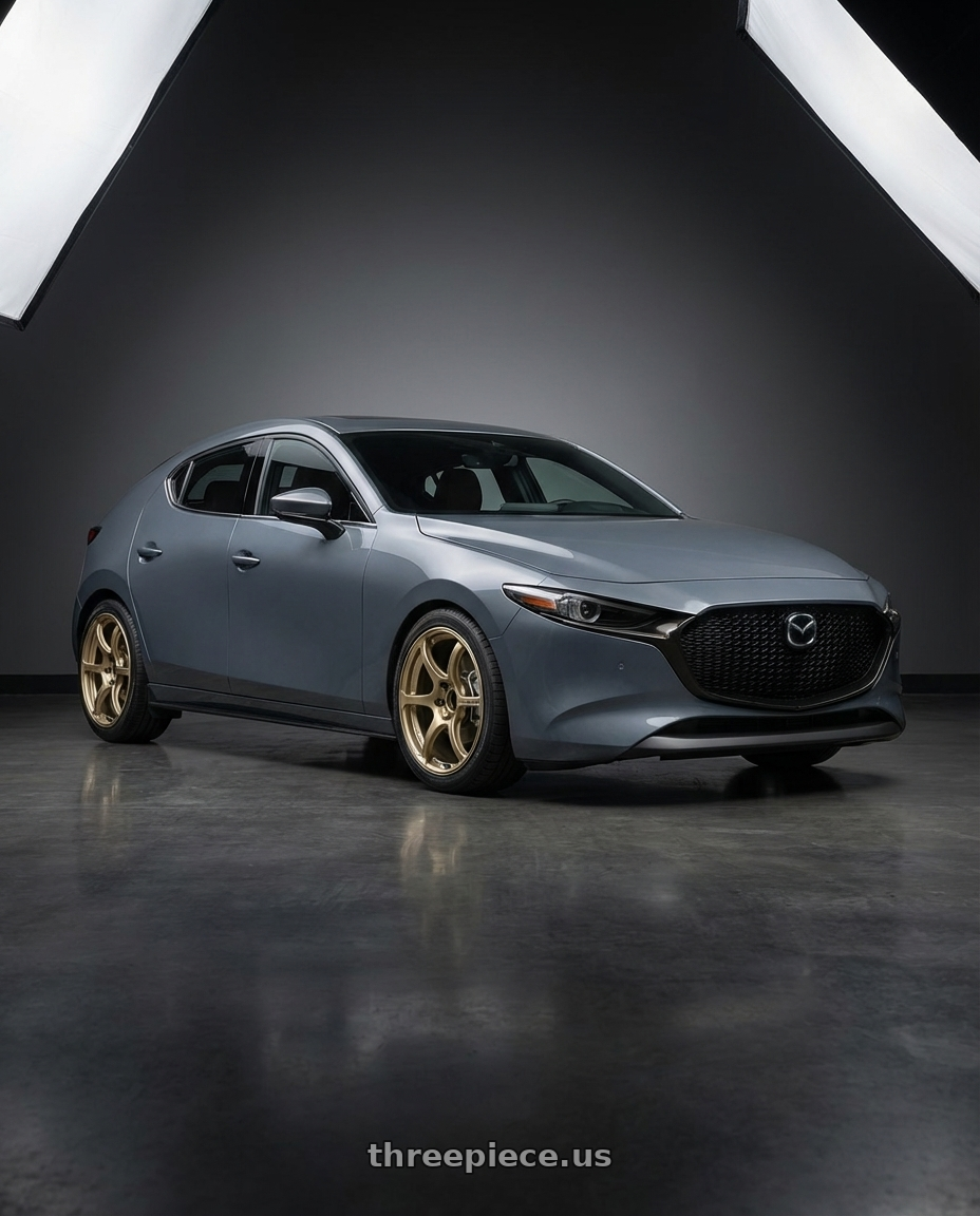 2023 Mazda Mazda3 Turbo with Advan RGIII 5x114.3 18x8.0+45 Gold wheels front three quarter view lowered stance