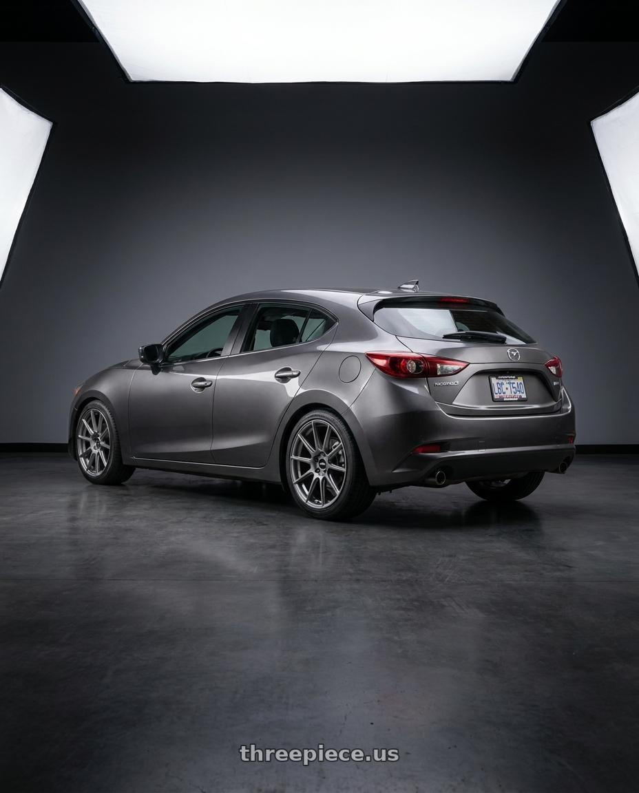 2017 Mazda Mazda3 Hatchback Grand with Enkei TS10 5x114.3 18x8+50 Grey wheels rear three quarter view square tires