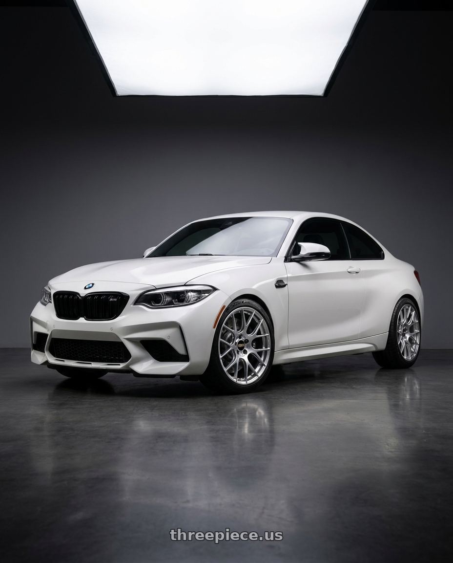 2019 BMW M2 Competition with BBS RE-V7 5x120 19x9.5 +25 Gloss Diamond Silver wheels front three quarter view stock stance
