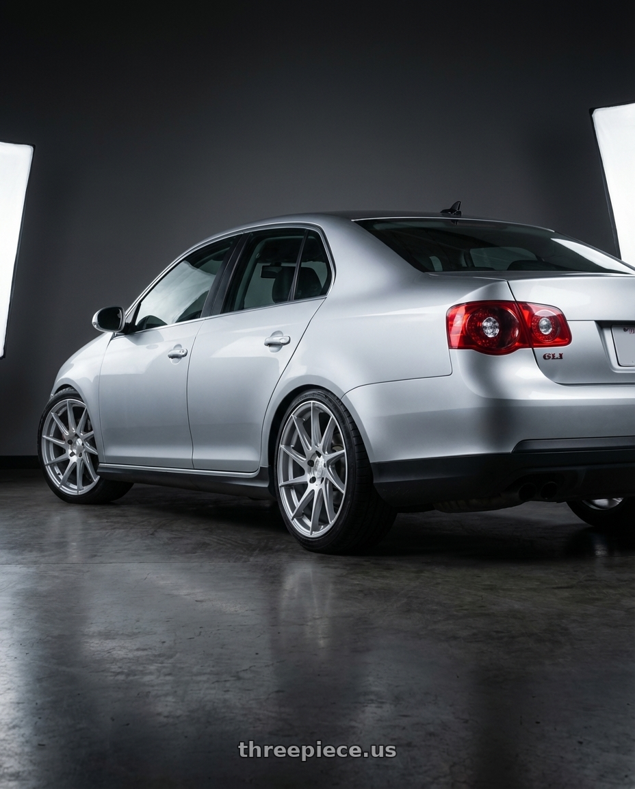 2009 Volkswagen Jetta GLI MK5 with Aodhan AH09 5x112 18x8.5 +35 Gloss Silver Machined Face wheels rear three quarter view square tires