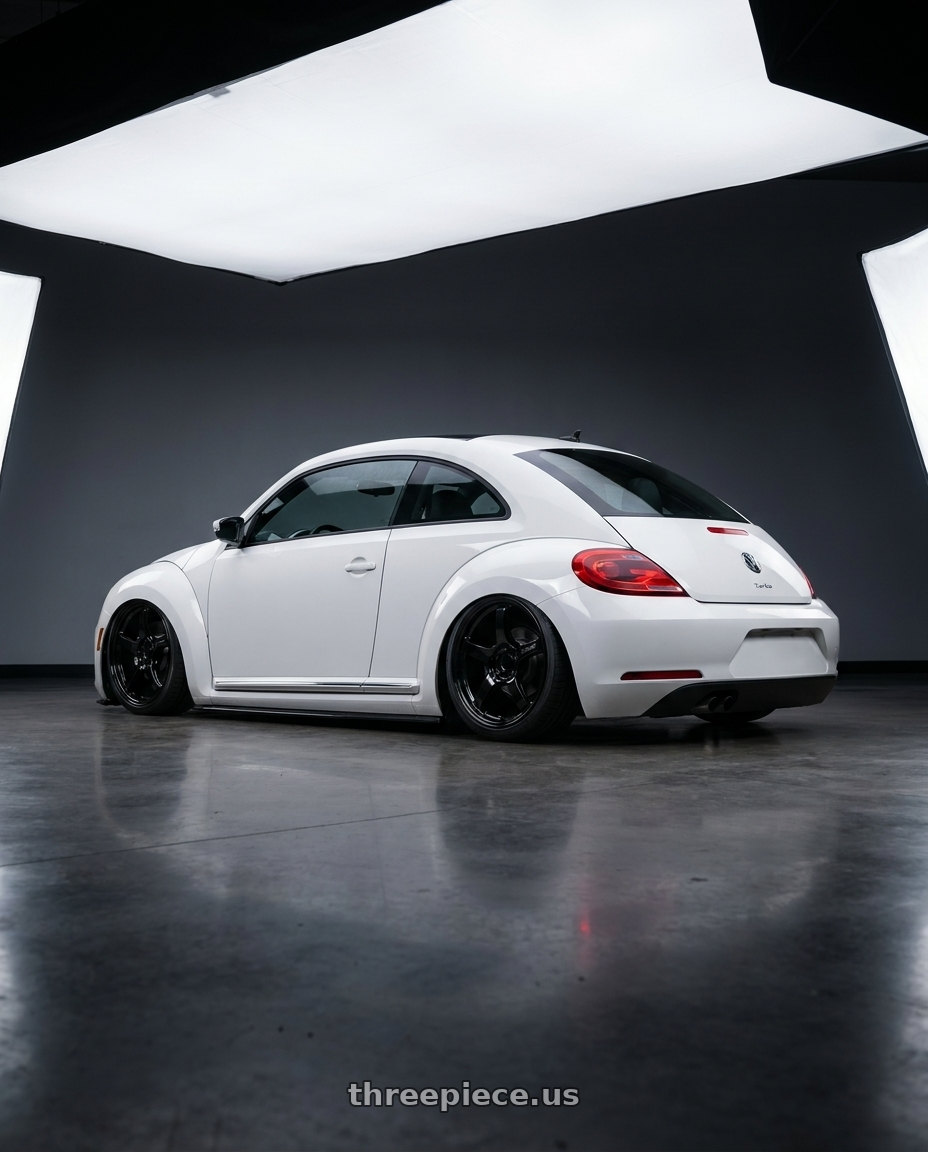 2016 Volkswagen Beetle Turbo with Gram Lights 57CR 5x112 19x10.5+22 Glossy Black wheels rear three quarter view slight stretch tires