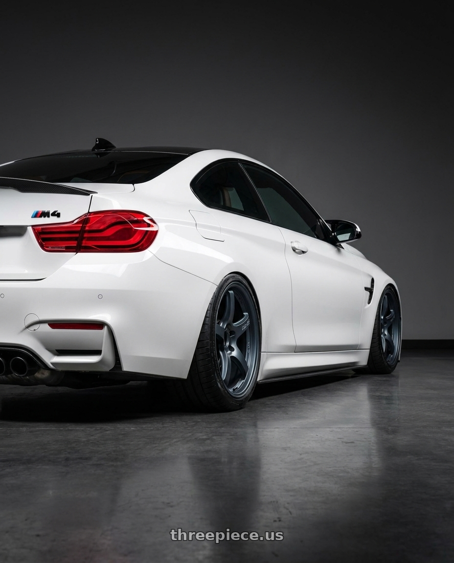 2018 BMW M4 F82 with Gram Lights 57CR 5x120 19x9.5+35 Gunblue II wheels rear three quarter view slight stretch tires