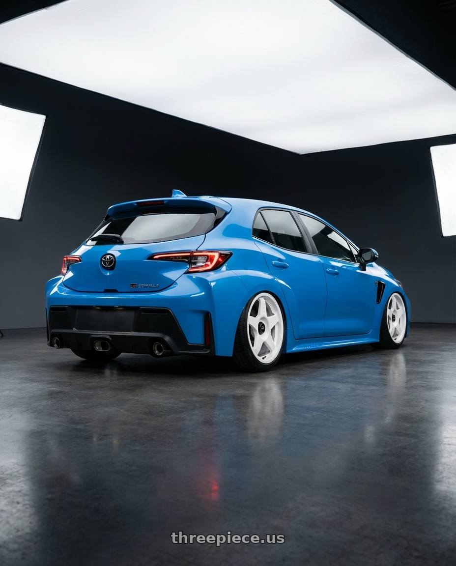 2024 Toyota GR Corolla with fifteen52 CHICANE 5x114.3 / 5x100 18x8.5 +35 RALLY WHITE (GLOSS WHITE) wheels rear three quarter view slight stretch tires