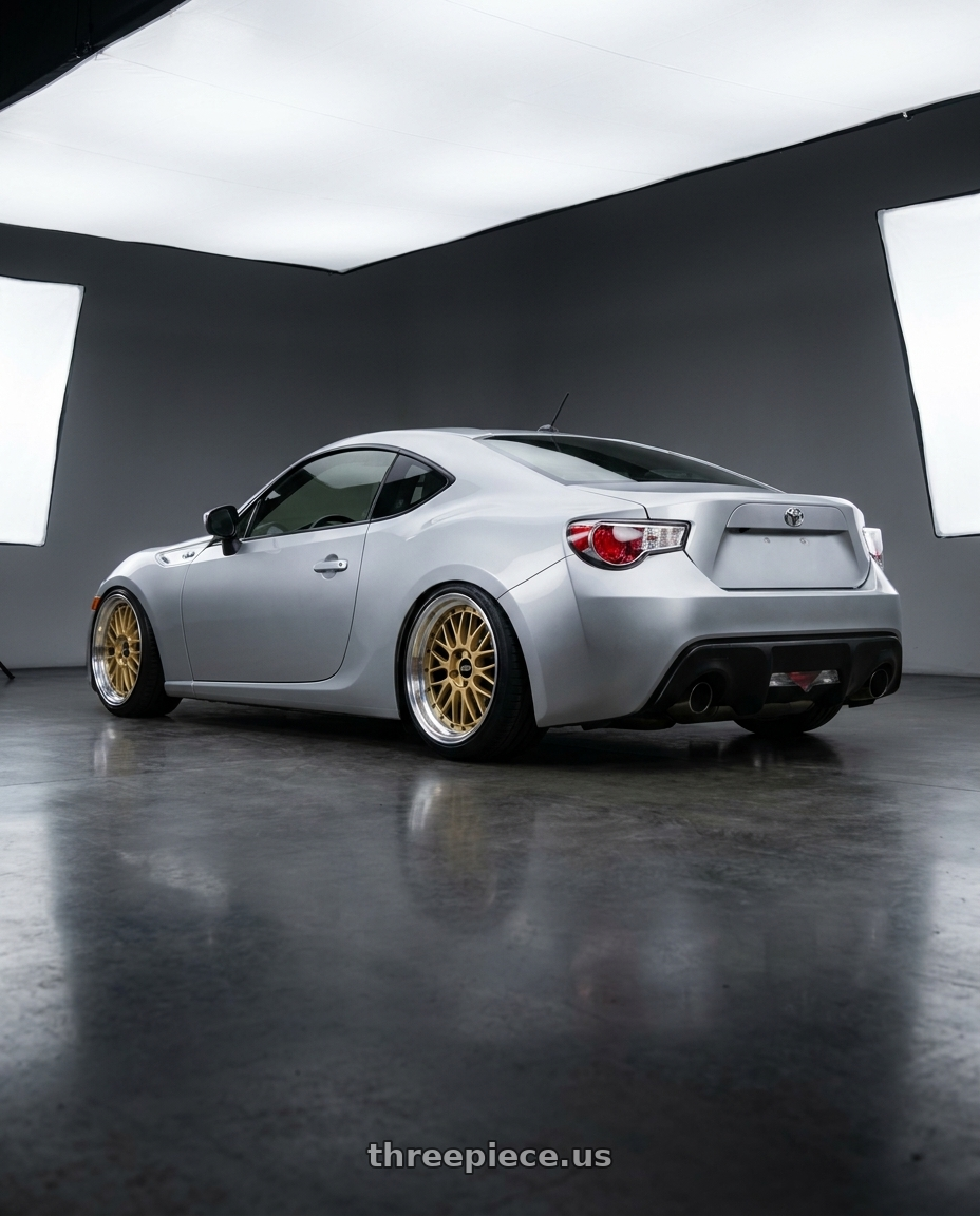 2014 Toyota 86 with BBS LM 5x114.3 18x9.0+42 Gold wheels rear three quarter view slight stretch tires