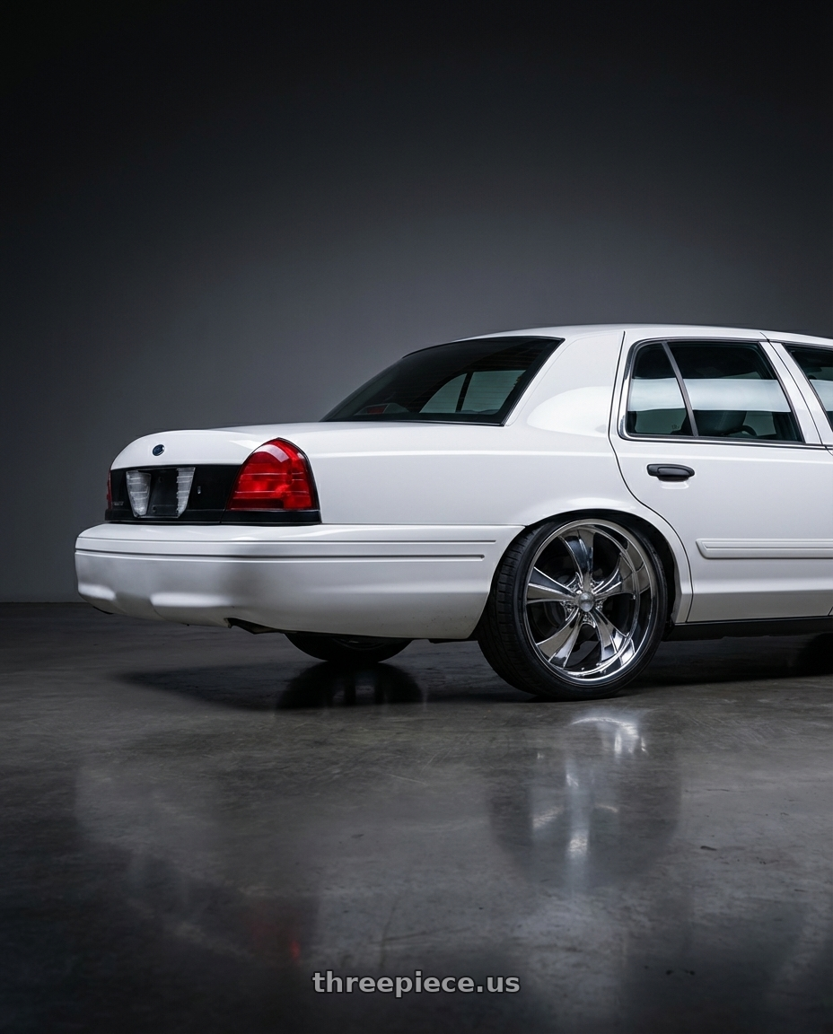 2011 Ford Crown Victoria Police Interceptor with Strada Street Classics Old Skool 6x139.7 24x10 +24 Chrome wheels rear three quarter view square tires