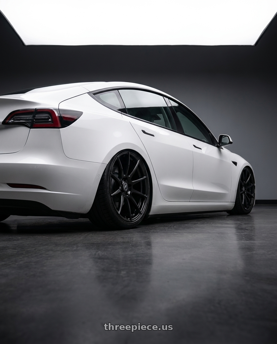 2023 Tesla Model 3 with Forgestar CF10 5x114.3 19x9 +35 Gloss Black wheels rear three quarter view slight stretch tires