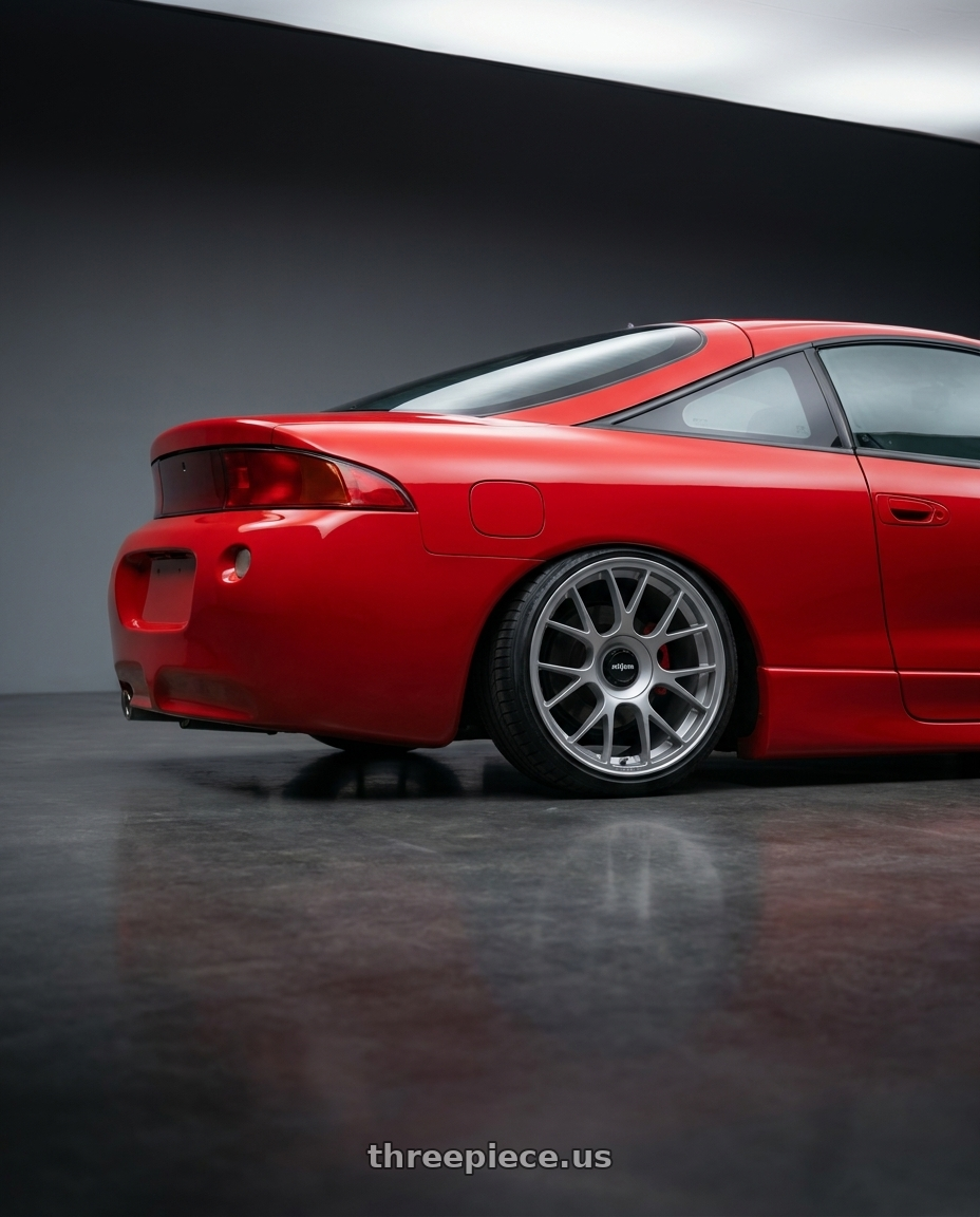 1996 mitsubishi eclipse with Rotiform TUF-R 5x112 18x9.5 +35 Satin Silver wheels rear three quarter view square tires