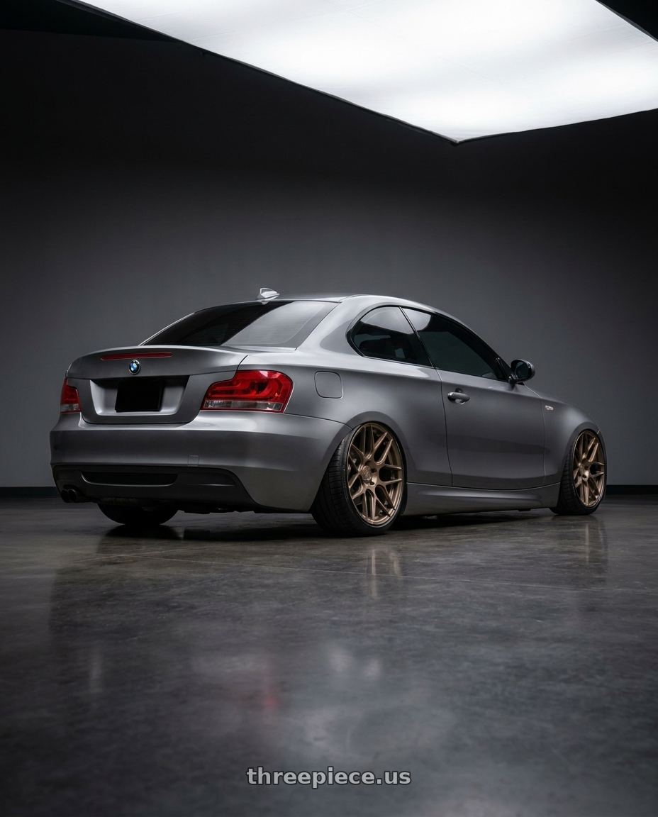 2012 BMW 1 Series E82 with Aodhan AFF2 5x120 19x8.5+35 Matte Bronze wheels rear three quarter view slight stretch tires
