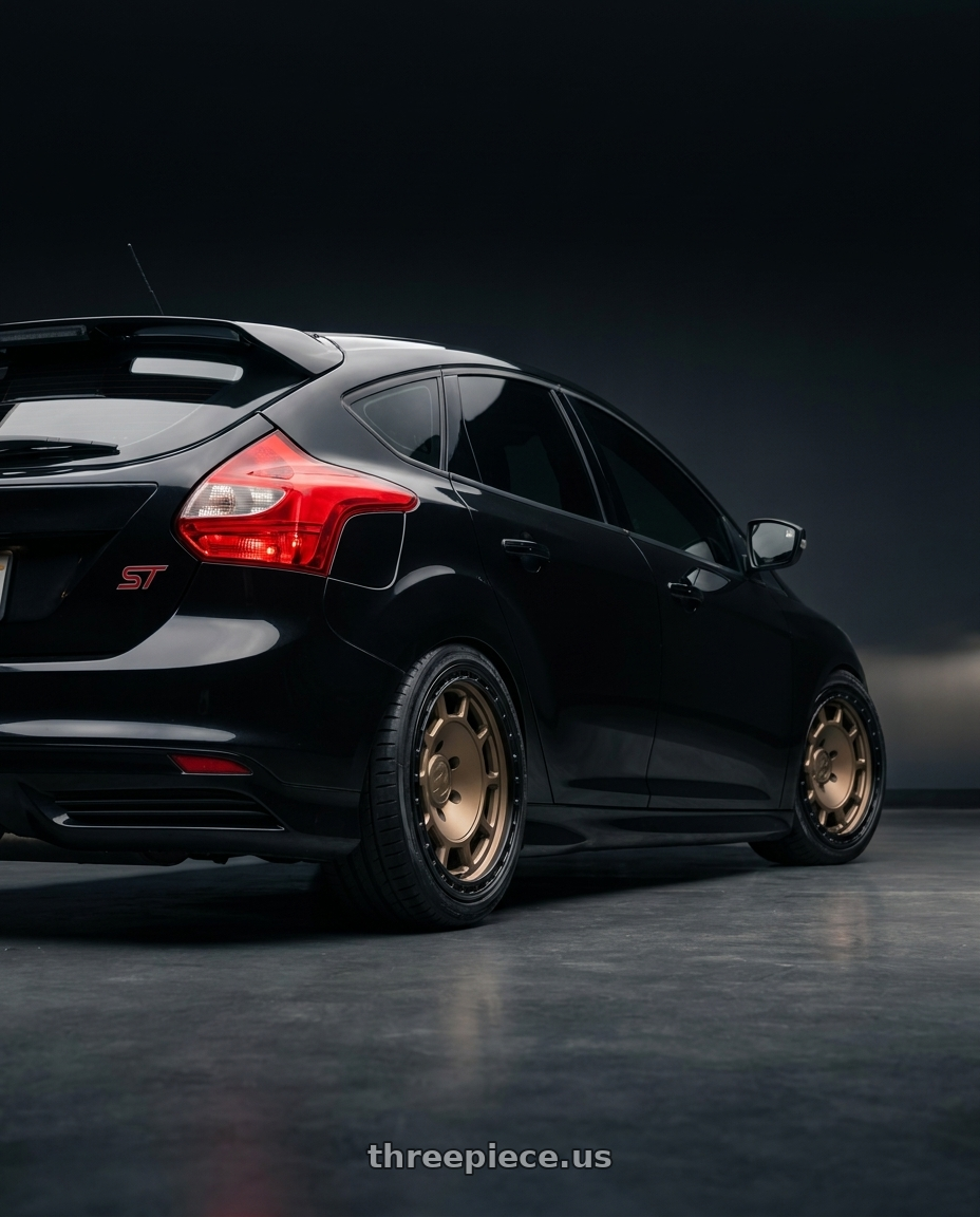 2013 black focus st  with fifteen52 TRAVERSE HD 5x150 17x8.5 +0 BLOCK BRONZE (MATTE BRONZE/SATIN BLACK RING) wheels rear three quarter view slight stretch tires
