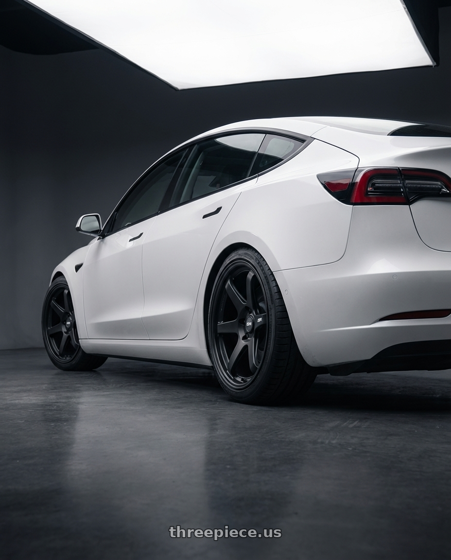 2023 Tesla Model 3 with ESR Wheels APEX SERIES AP6 5x114.3 19x8.5 +30 Matte Black wheels rear three quarter view square tires