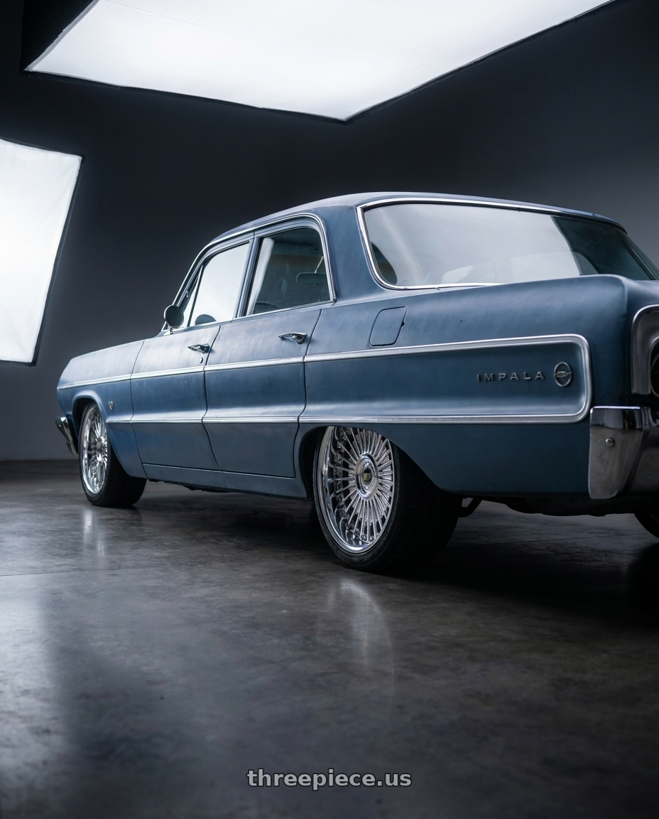 1964 Chevy impala with Work Emitz wheels rear three quarter view square tires