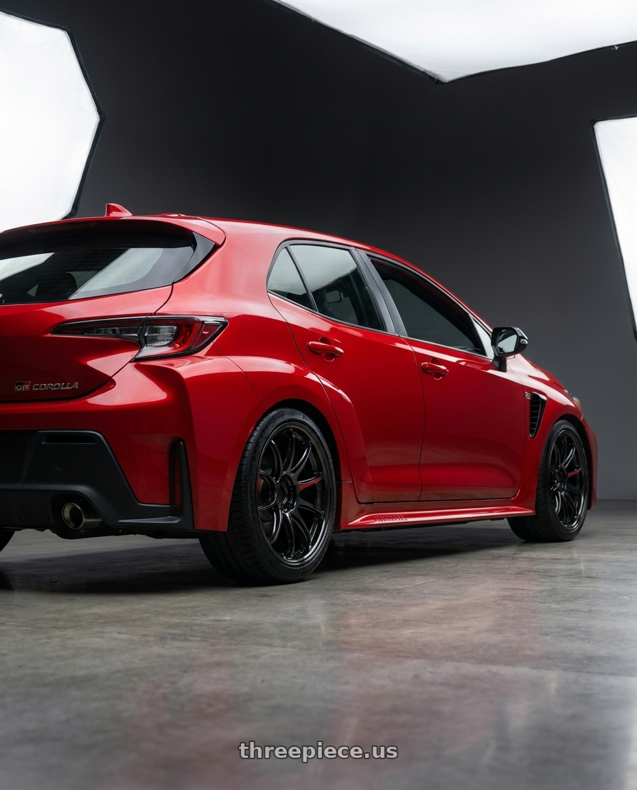 2026 Toyota GR Corola with Work Zr10 2P 5x114.3 18x9.0 +22 Glim Black wheels rear three quarter view square tires