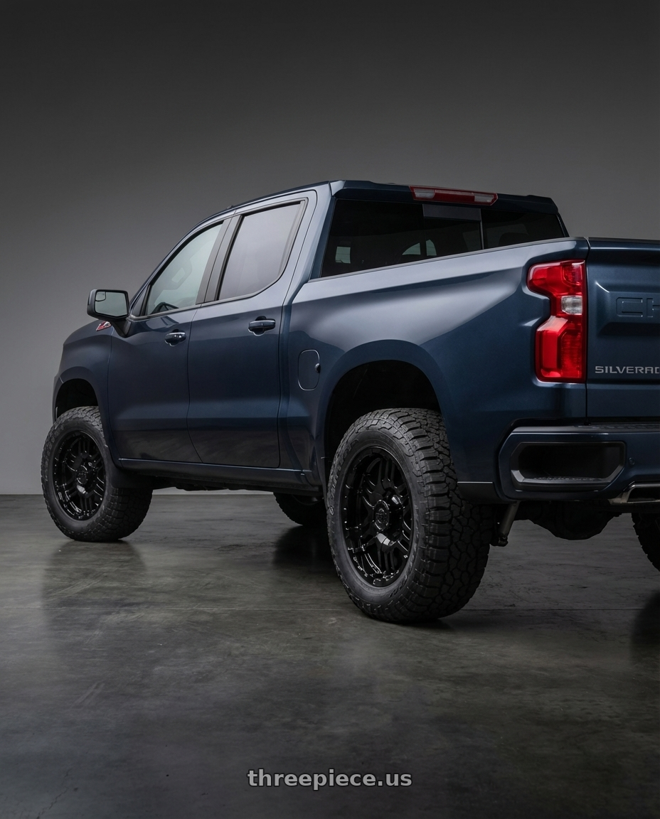 2023 Chevrolet Silverado 1500 with Gear Off Road 713B 6x139.7 20x9 +10 Gloss Black wheels rear three quarter view meaty tires