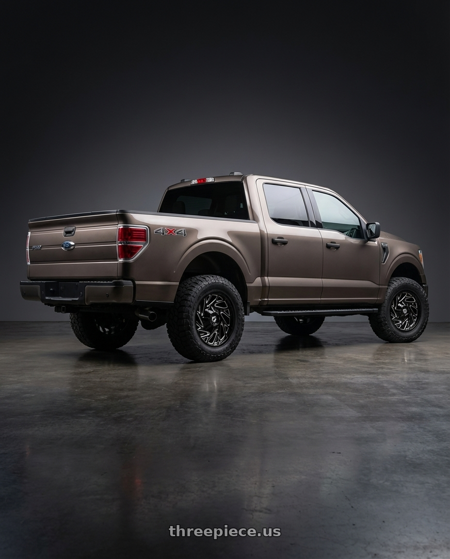 2013 Ford F-150 with Gear Off Road 769BM 6X135/6x139.7 20x9 +0 Gloss Black Milled wheels rear three quarter view meaty tires