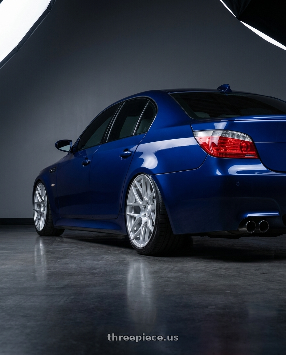 2010 BMW M5 E60 with Aodhan AFF2 5x120 20x10.5+35 Gloss Silver Machined Face wheels rear three quarter view slight stretch tires