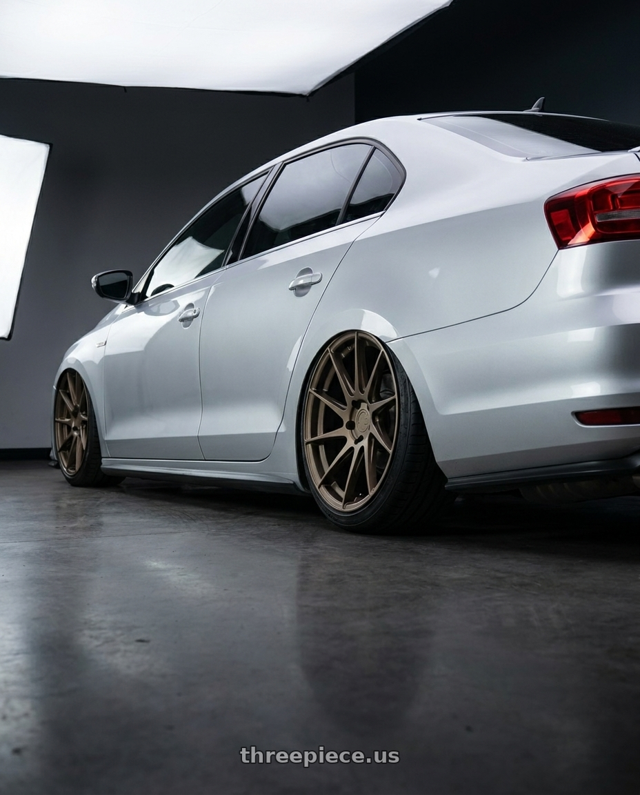 2016 Volkswagen Jetta GLI MK6 with Aodhan AH09 5x112 18x8.5 +35 Matte Bronze wheels rear three quarter view slight stretch tires