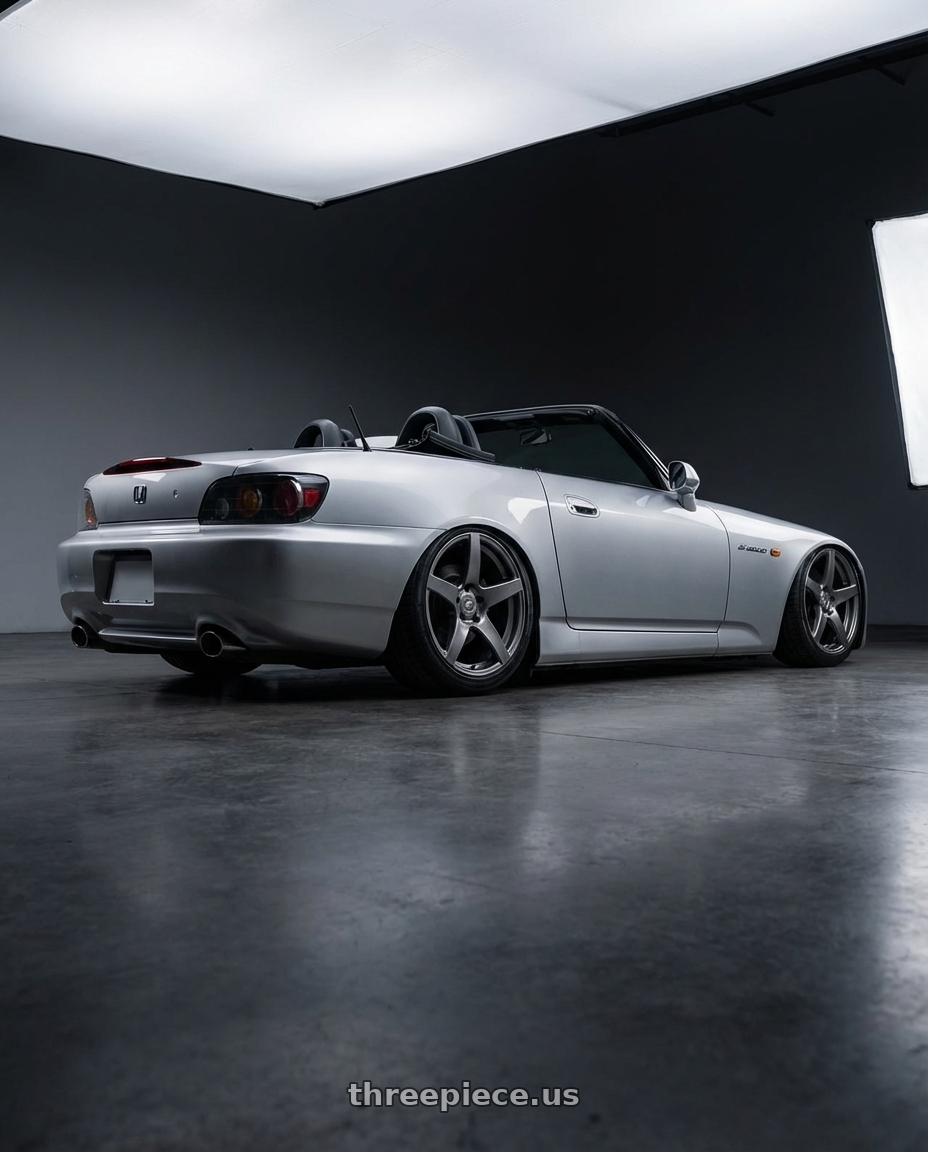 2009 Honda S2000 with Forgestar CF5 5x114.3 18x9 +35 Gloss Anthracite wheels rear three quarter view slight stretch tires