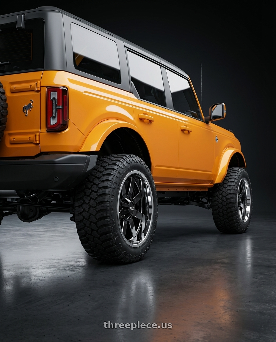 2024 Ford Bronco with Moto Metal MO200 6X139.7 20X12 -44 GLOSS BLACK MILLED CENTER CHROME LIP wheels rear three quarter view meaty tires