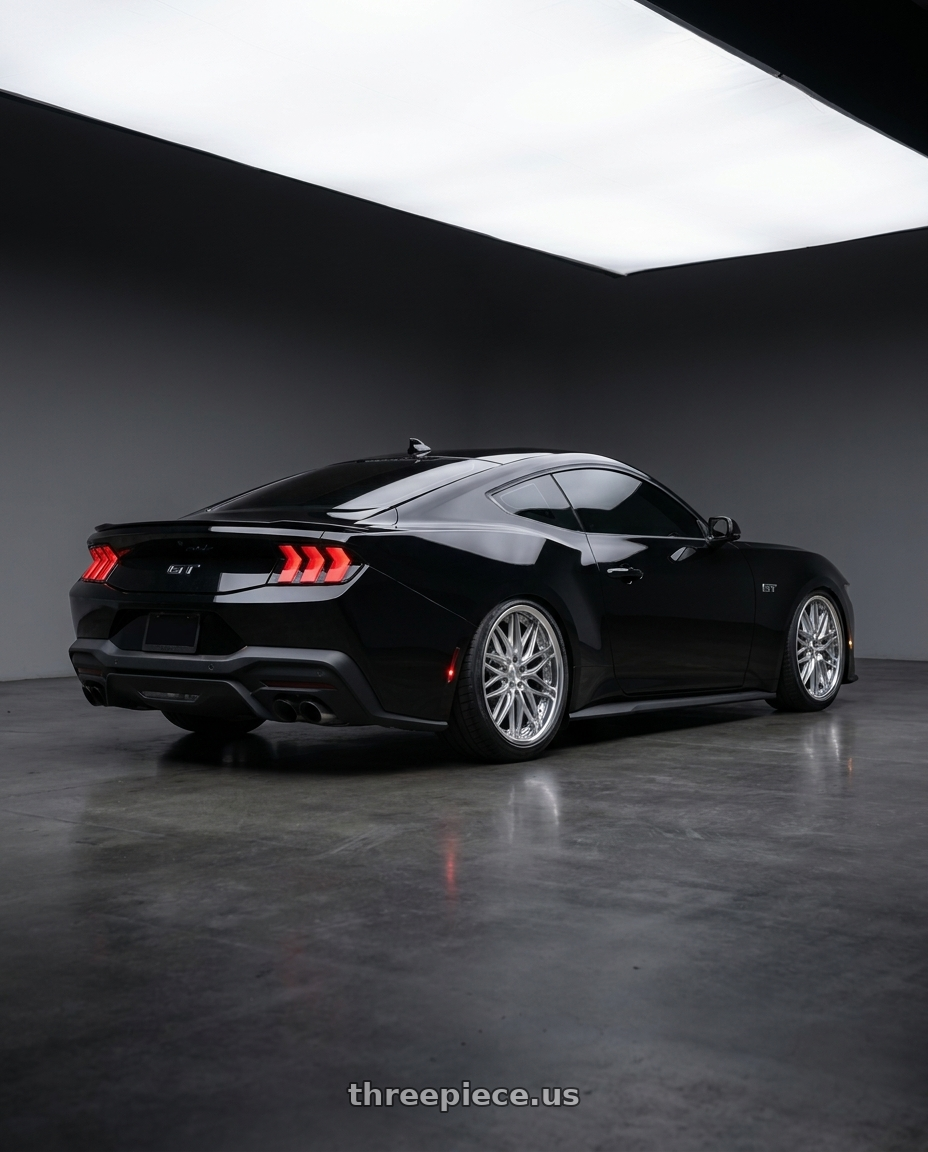 2024 ford mustang gt with Work Schwert Quell 5x114.3 19x9.5+38 A Disk Silky Rich Silver wheels rear three quarter view slight stretch tires