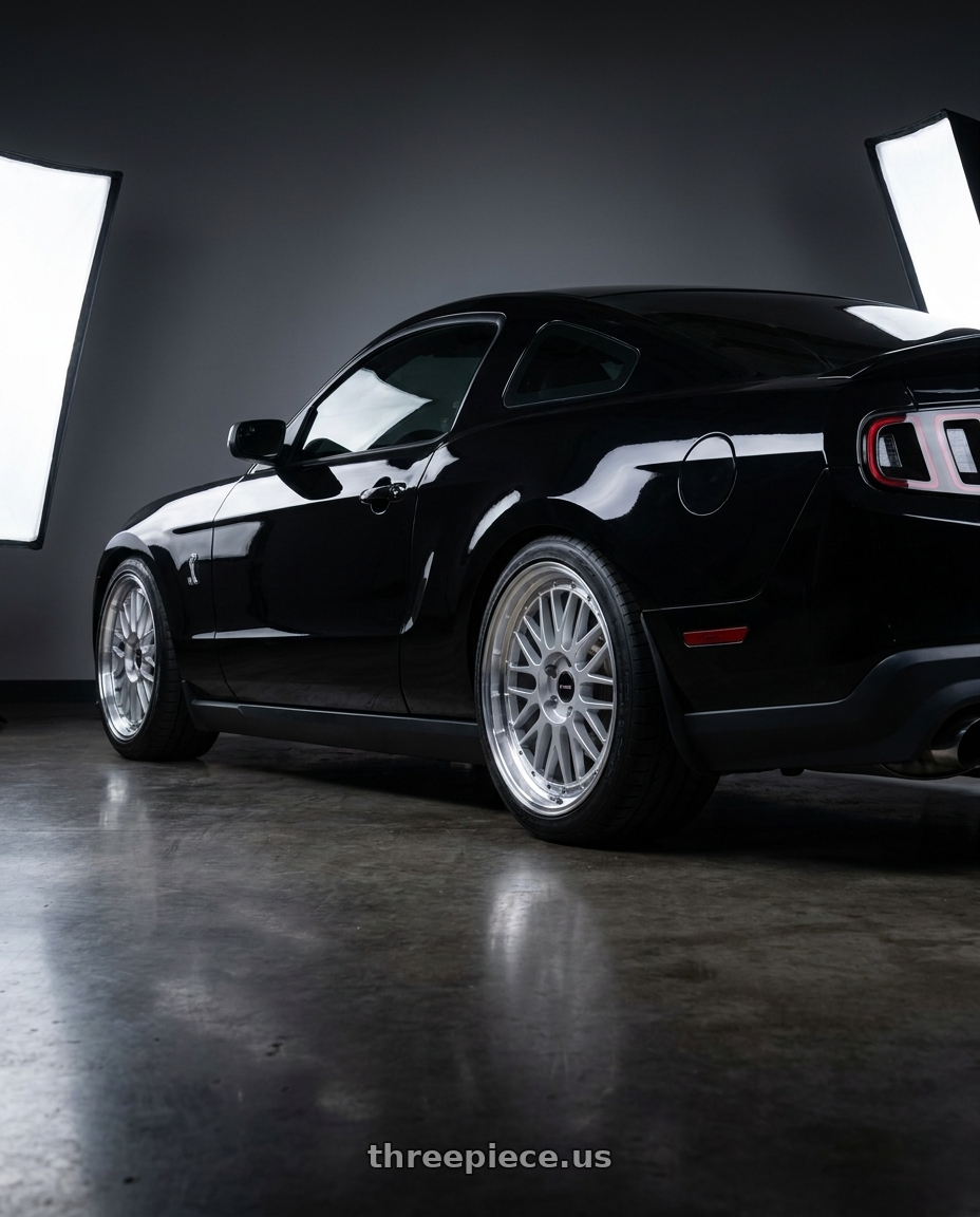 2011 GT500 SVT Performance Package Black with Vors VR8 5x114.3 19x9.5  +35 Silver Machine Lip Chrome Rivet wheels rear three quarter view square tires