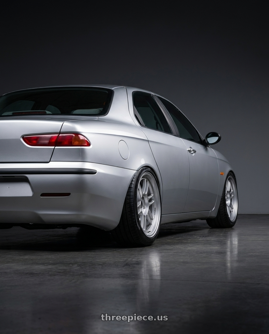 1998 Alfa romeo 156 with Enkei RPF1 4x100 17x7+43 Silver wheels rear three quarter view slight stretch tires