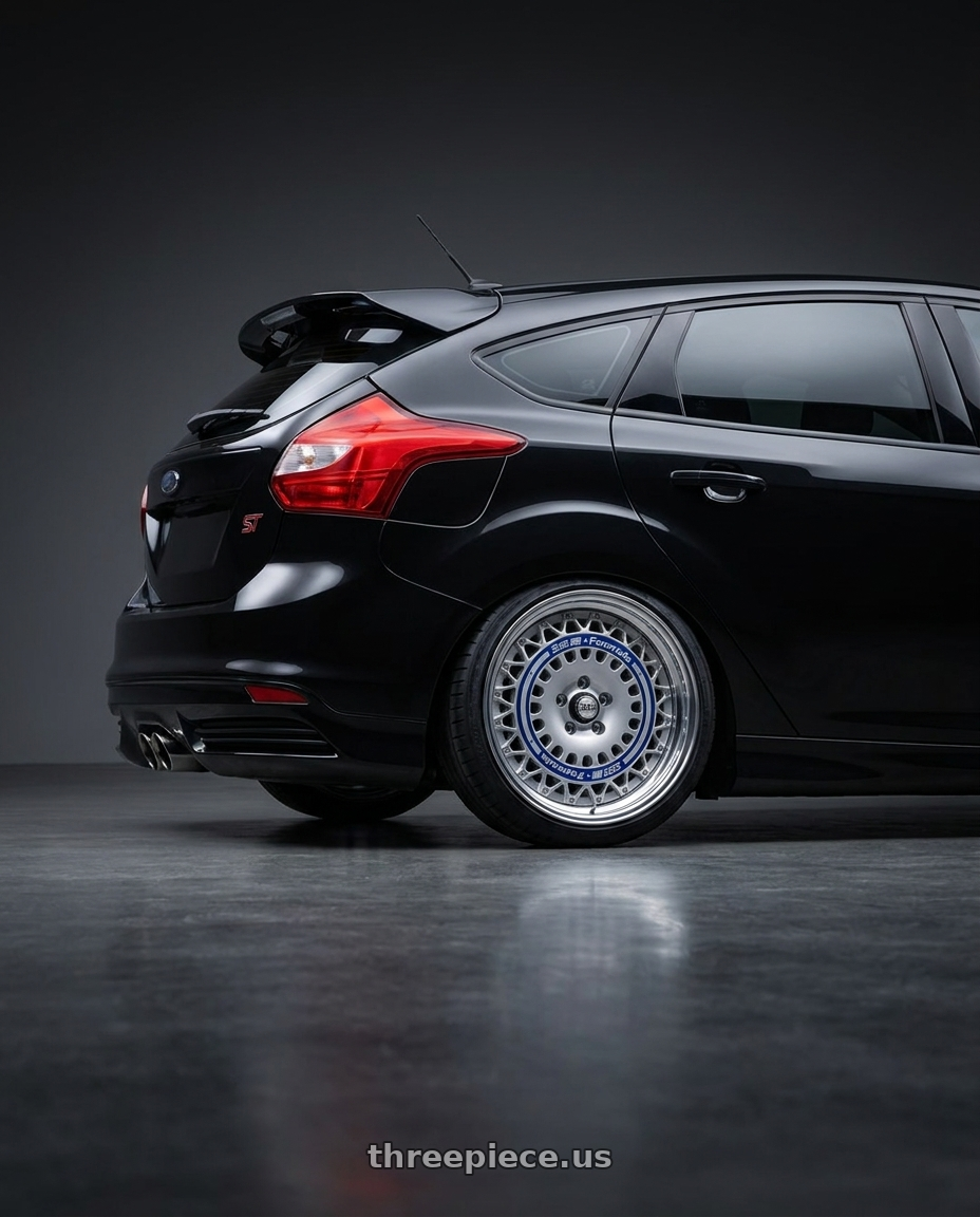 2013 ford focus st black  with FORMULA AERO MESH 5x108 18X9.5+43 NR Disk Titan Silver wheels rear three quarter view slight stretch tires