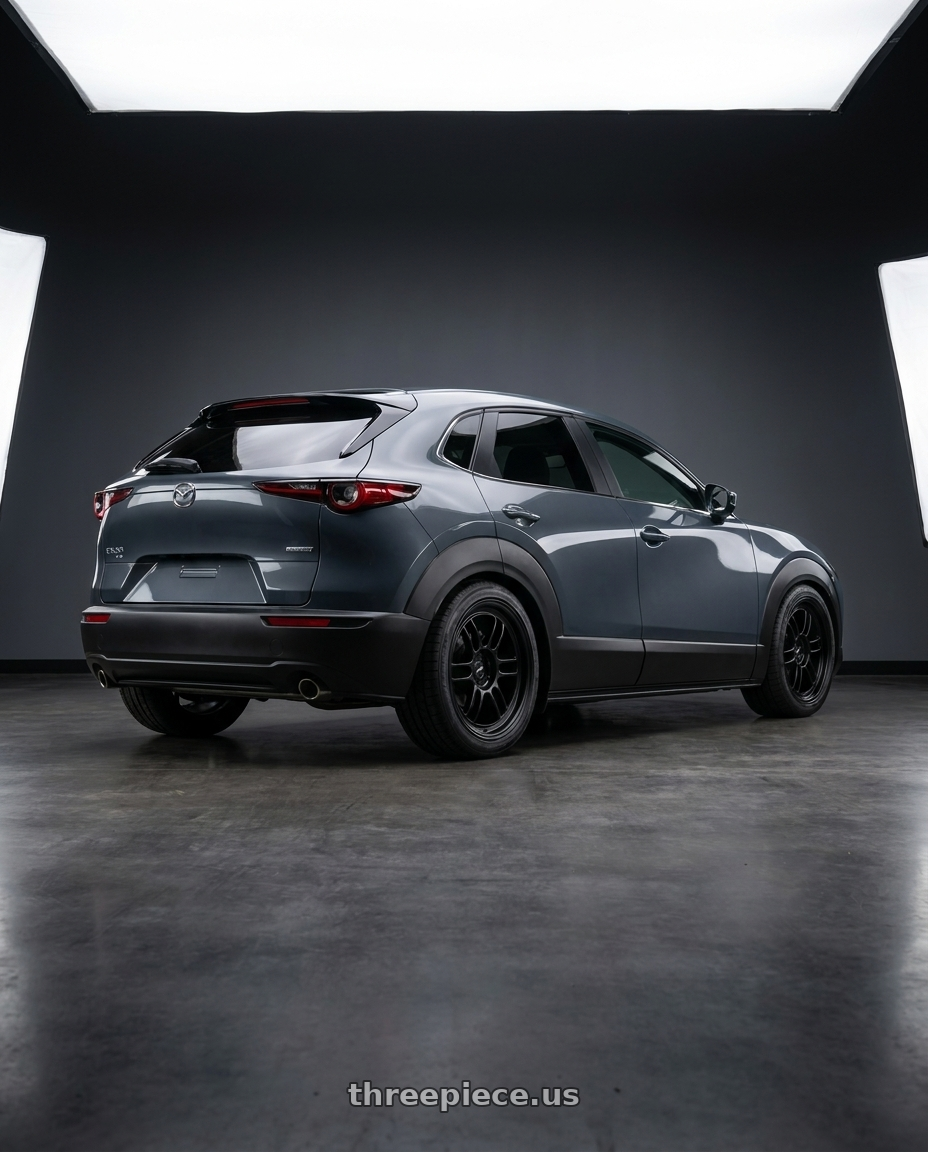 2026 mazda cx30 with Enkei RPF1 5x114.3 17x9+35 Black wheels rear three quarter view square tires